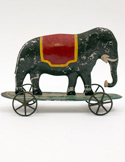 Early American Antique Painted Tin Toy Elephant on Base with Wheels Early American Antique Painted Tin Toy Elephant on Base with Wheels