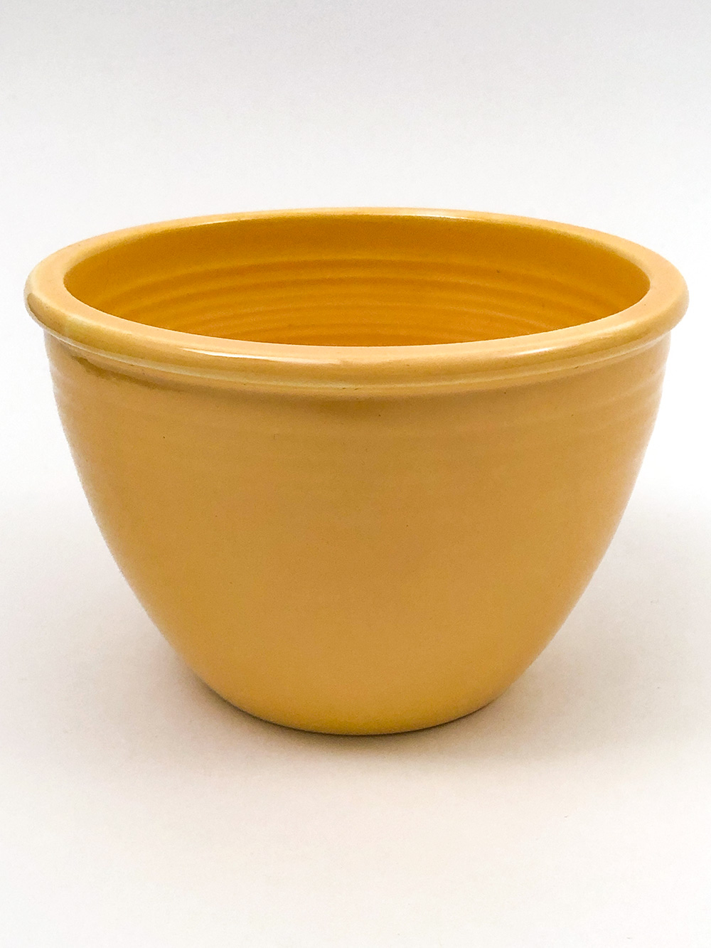Number 2 yellow vintage fiesta nesting bowl inside bottom rings