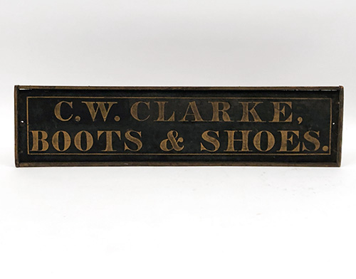 antique wooden boot and shoes trade sign c.w. clarke